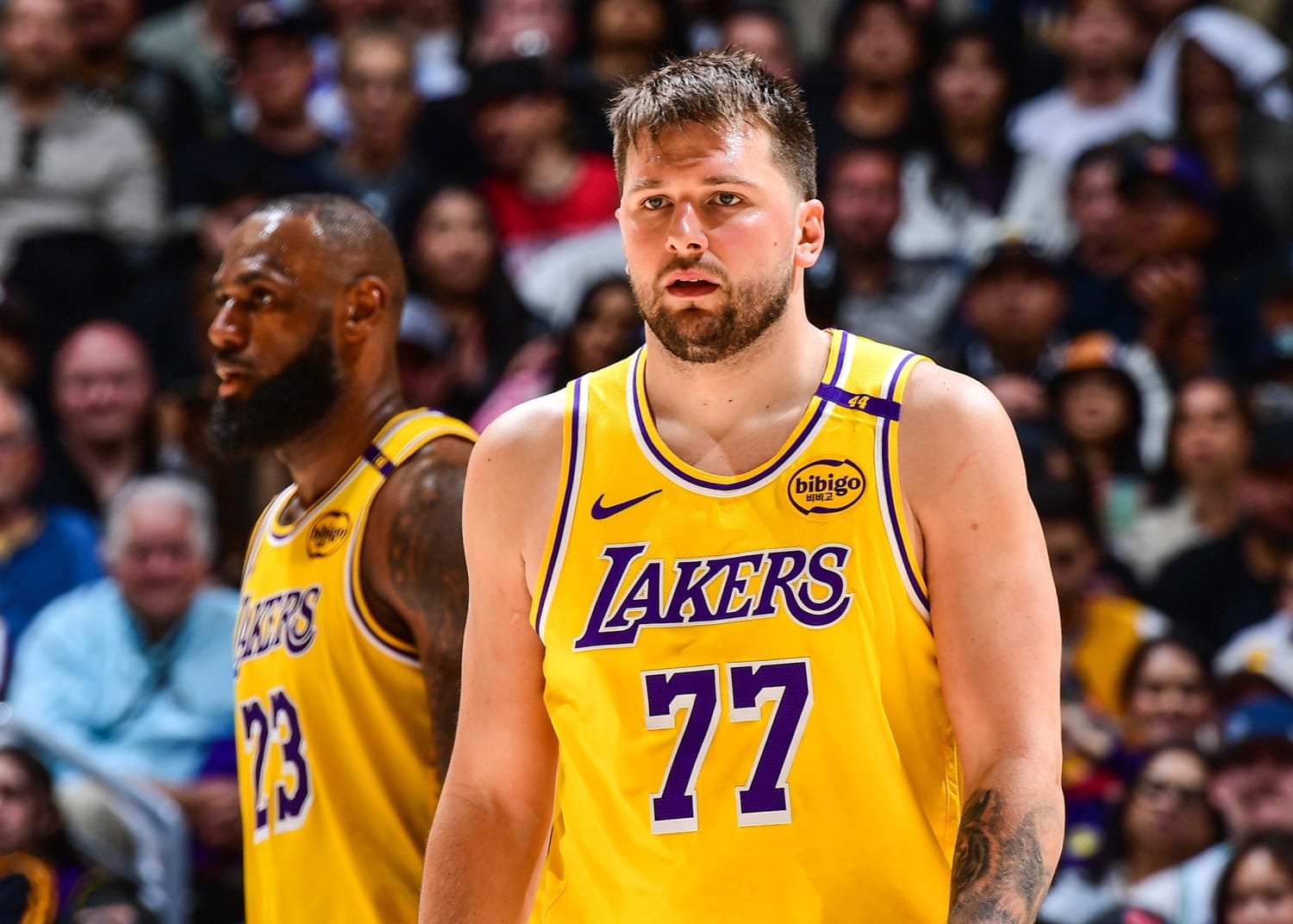 LeBron James and Luka Doncic in Lakers gold uniforms