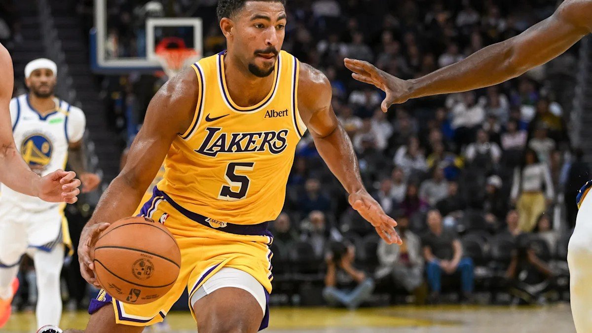 Quentin Grimes wearing a gold Lakers number 5 jersey on the court