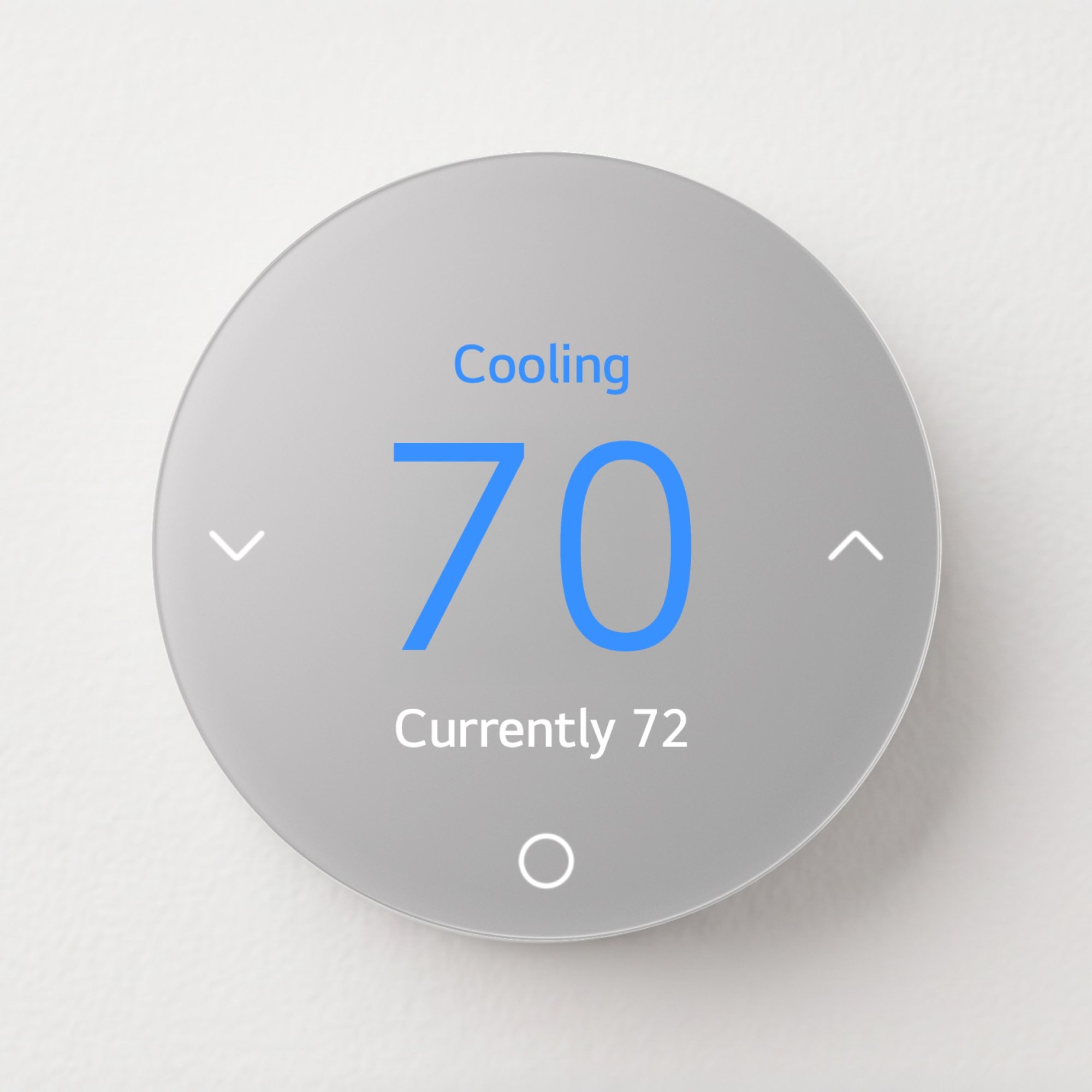 Round silver LG Smart Thermostat on a wall showing Cooling, 70 degrees, currently 72